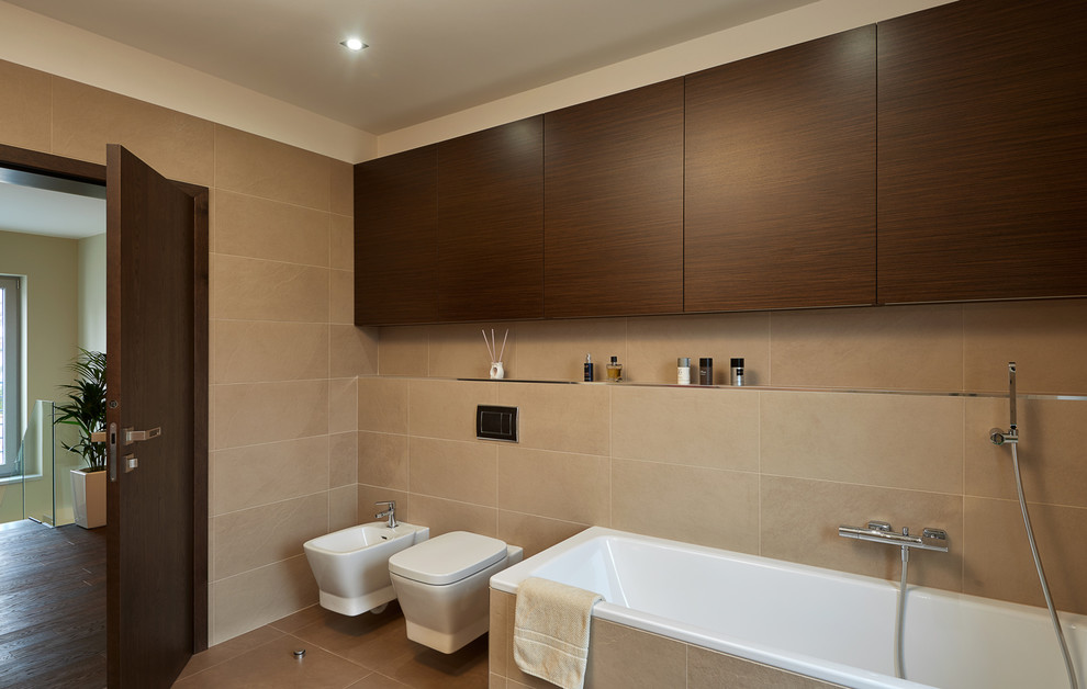 Inspiration for a small modern master bathroom in Other with flat-panel cabinets, medium wood cabinets, a corner tub, a corner shower, a two-piece toilet, beige tile, ceramic tile, beige walls, ceramic floors, a pedestal sink and wood benchtops.