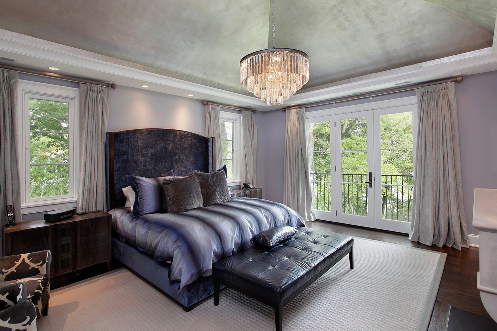 This is an example of a transitional bedroom in Chicago with grey walls.