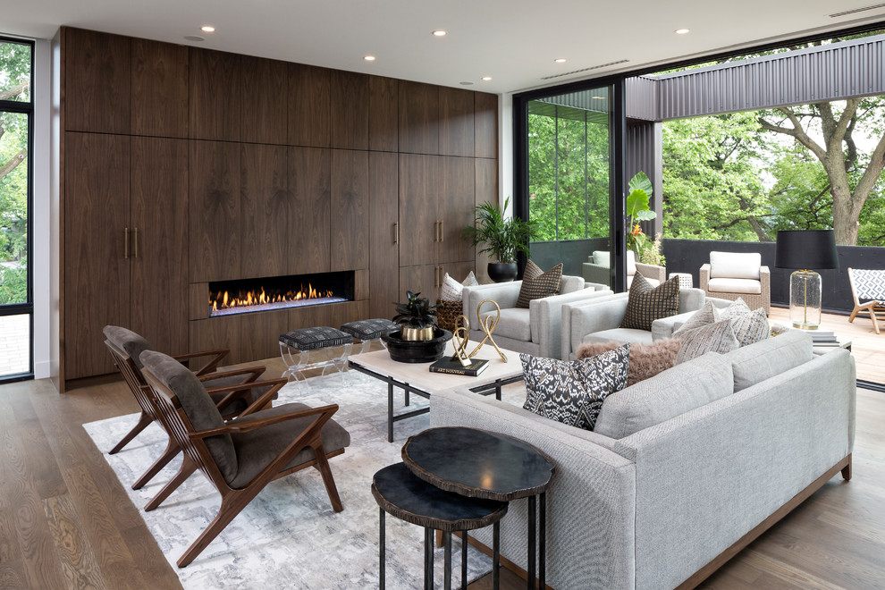 Inspiration for a contemporary formal open concept living room in Minneapolis with dark hardwood floors, a ribbon fireplace and a wood fireplace surround.