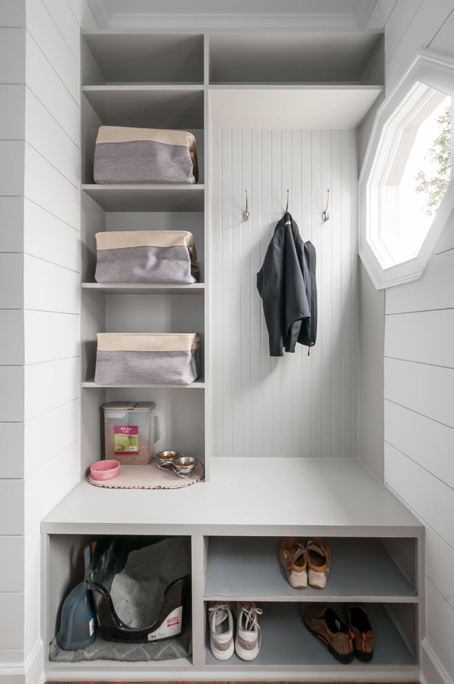 Beach style mudroom in Atlanta with white walls.