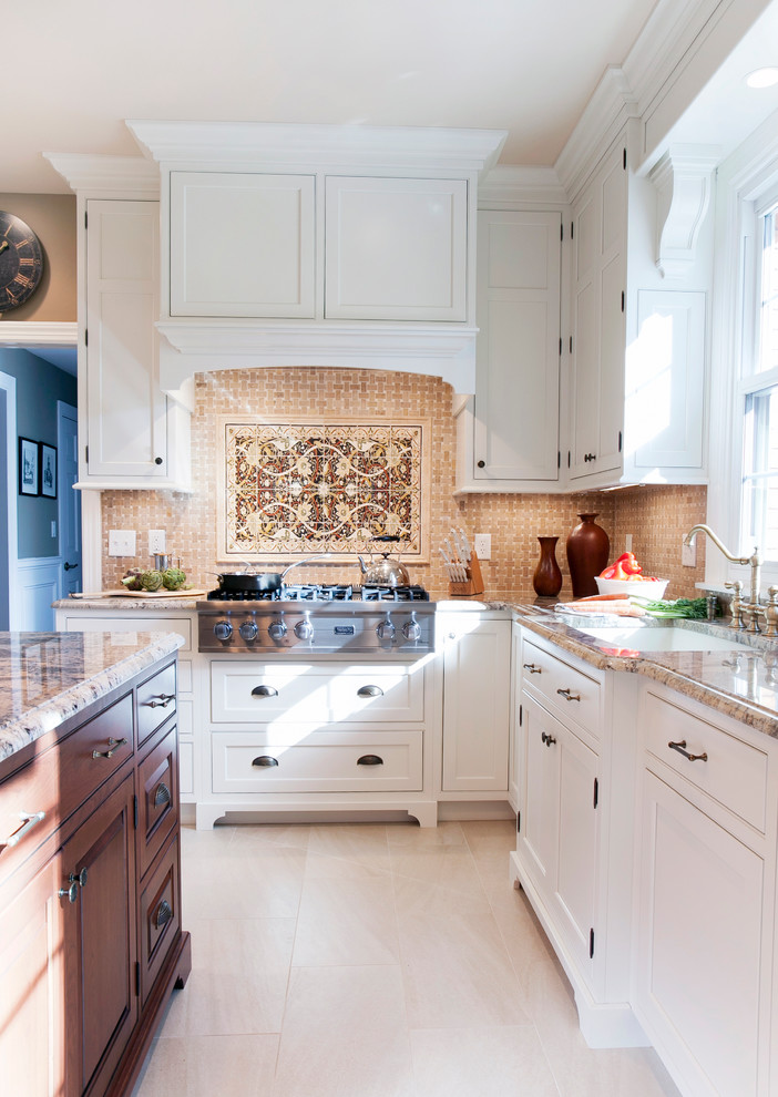 This is an example of a traditional u-shaped separate kitchen in Bridgeport with an undermount sink, shaker cabinets, white cabinets, granite benchtops, beige splashback and panelled appliances.