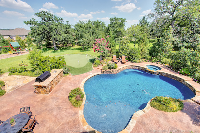 Photo of an expansive traditional pool in Dallas.