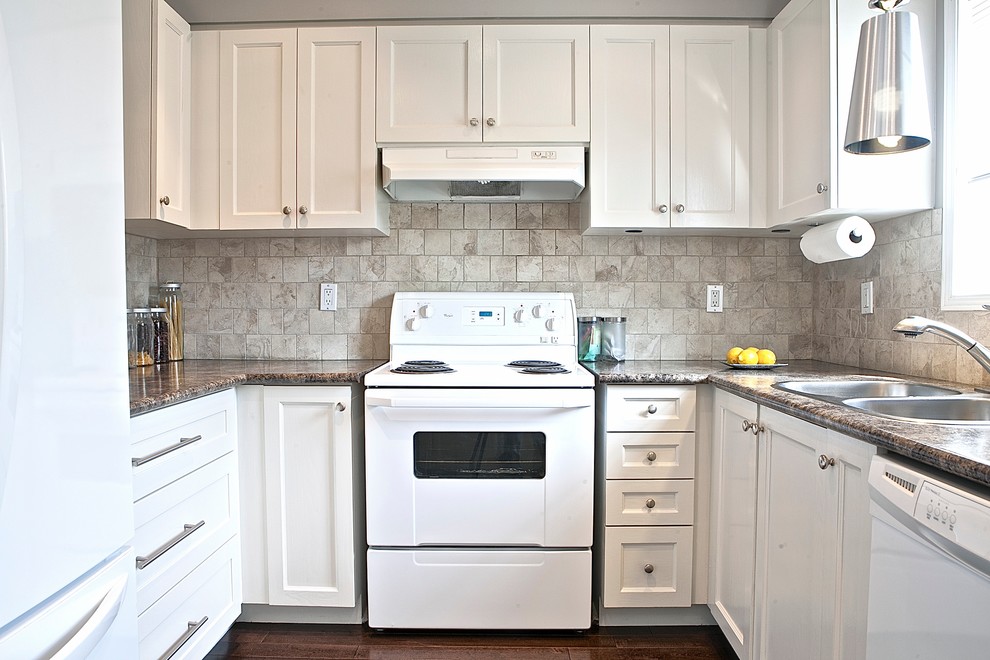 Example of a small transitional u-shaped dark wood floor eat-in kitchen design in Toronto with a double-bowl sink, shaker cabinets, white cabinets, laminate countertops, beige backsplash, porcelain backsplash, white appliances and no island