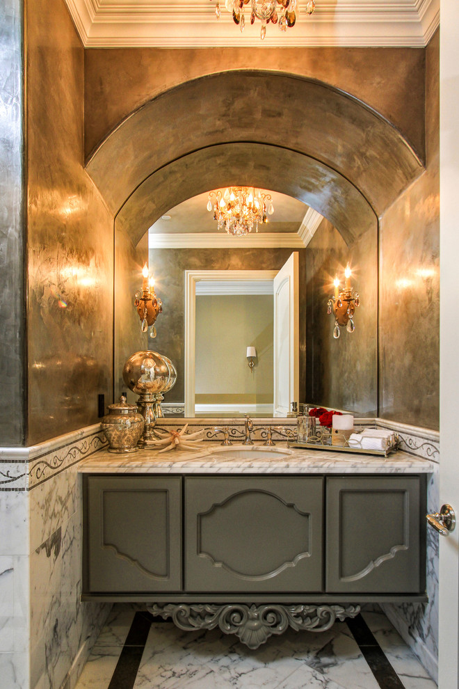 Inspiration for a mediterranean powder room in Los Angeles with an undermount sink, recessed-panel cabinets, grey cabinets, marble benchtops, marble floors and marble.