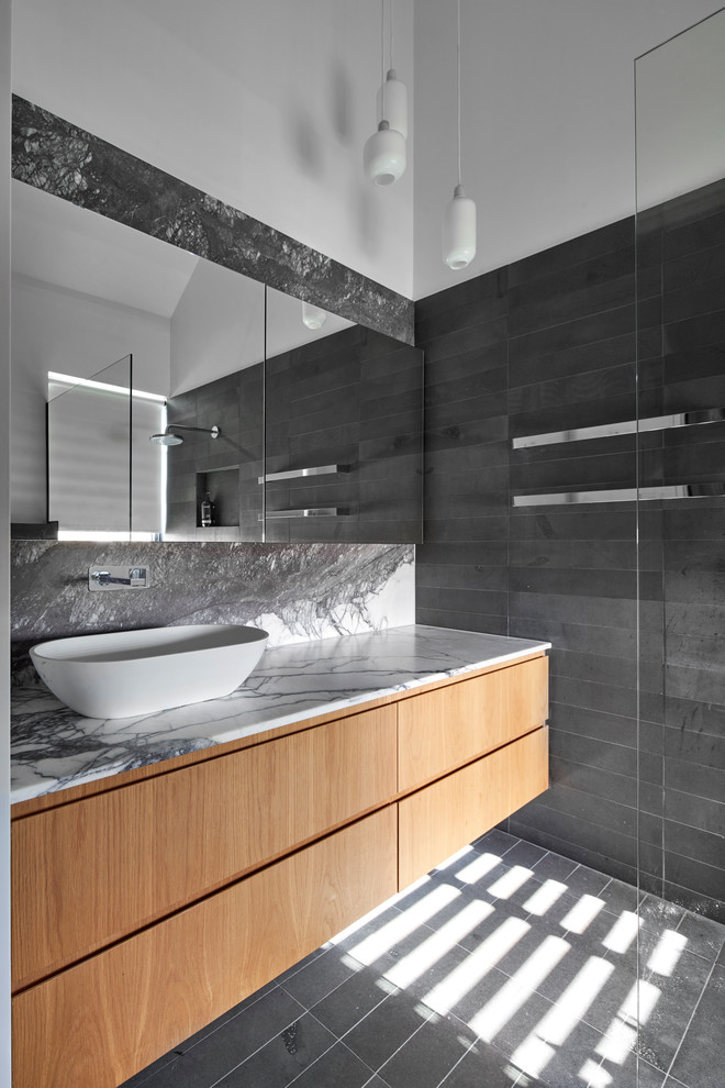 Design ideas for a contemporary master bathroom in Melbourne with marble benchtops.