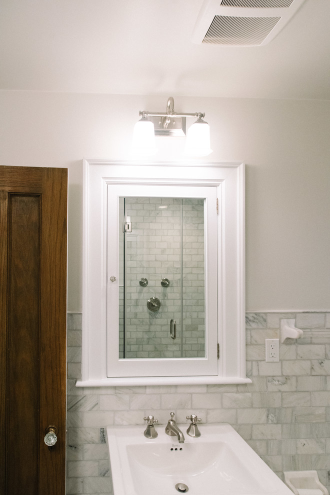 Mid-sized transitional 3/4 subway tile and gray tile bathroom photo with a pedestal sink and gray walls