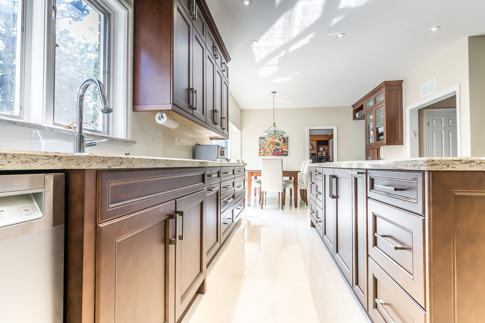Example of a transitional kitchen design in Toronto