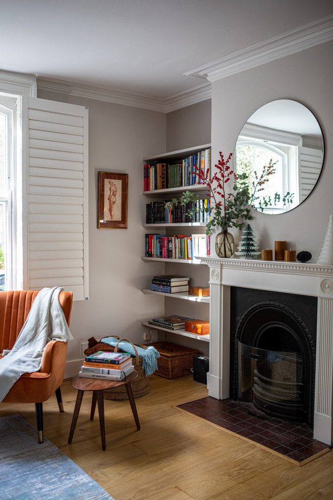 Photo of a medium sized midcentury formal and grey and brown open plan living room in London with grey walls, light hardwood flooring, a standard fireplace, a stone fireplace surround, brown floors and a chimney breast.