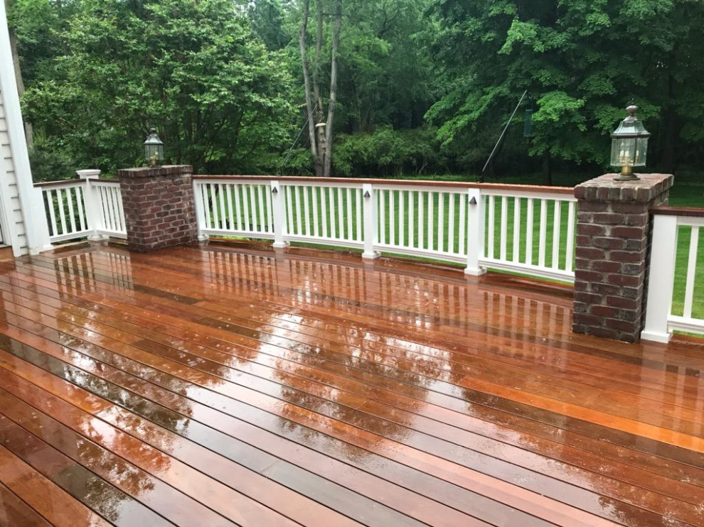 Inspiration for a large transitional backyard deck remodel in Philadelphia with no cover