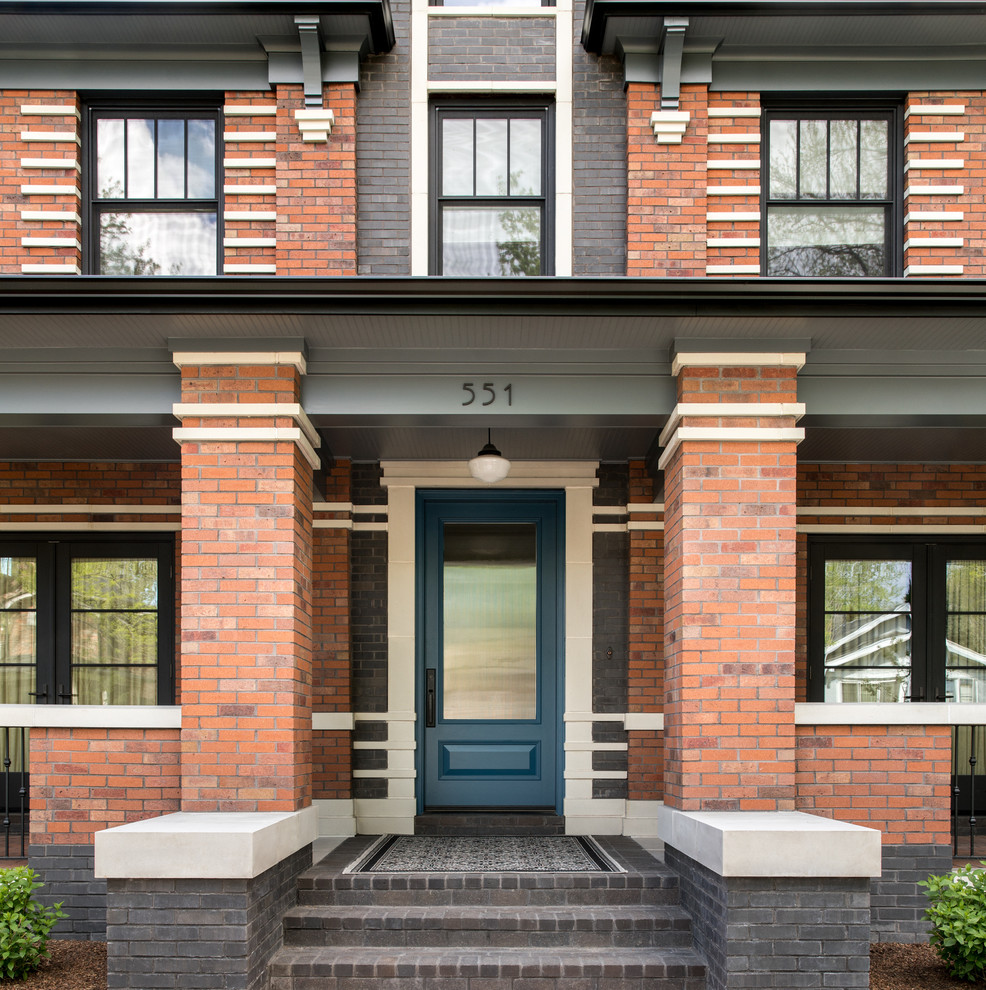 Design ideas for an expansive traditional two-storey brick exterior in Denver.