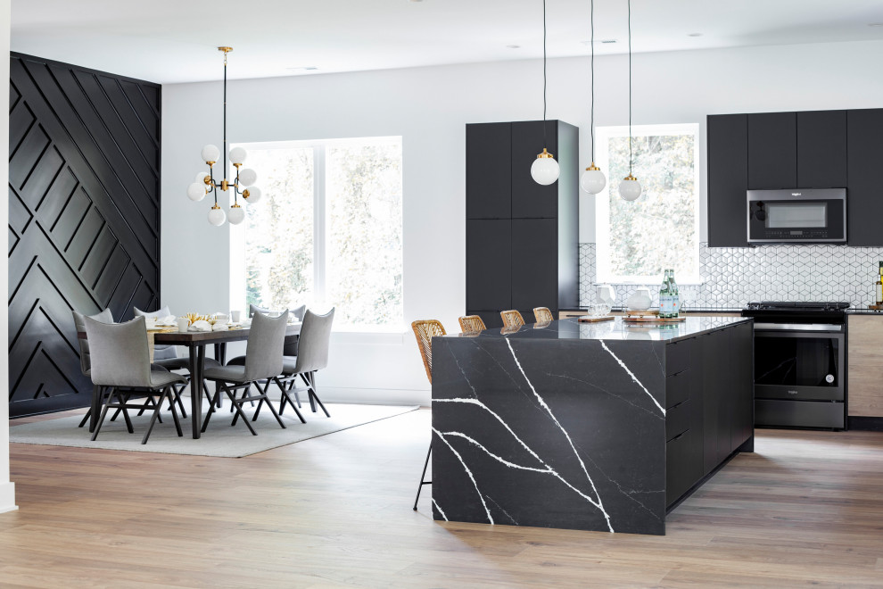 This is an example of a contemporary kitchen in Charlotte with flat-panel cabinets, black cabinets, quartz benchtops, white splashback, with island and black benchtop.