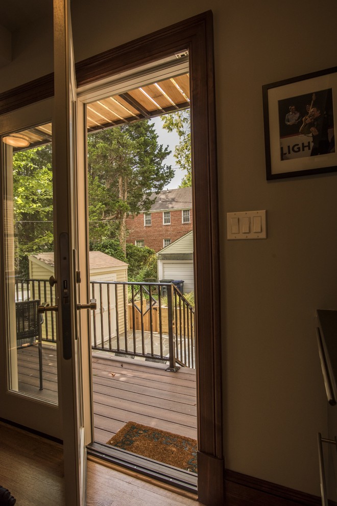 Inspiration for a small transitional backyard deck remodel in DC Metro with a pergola