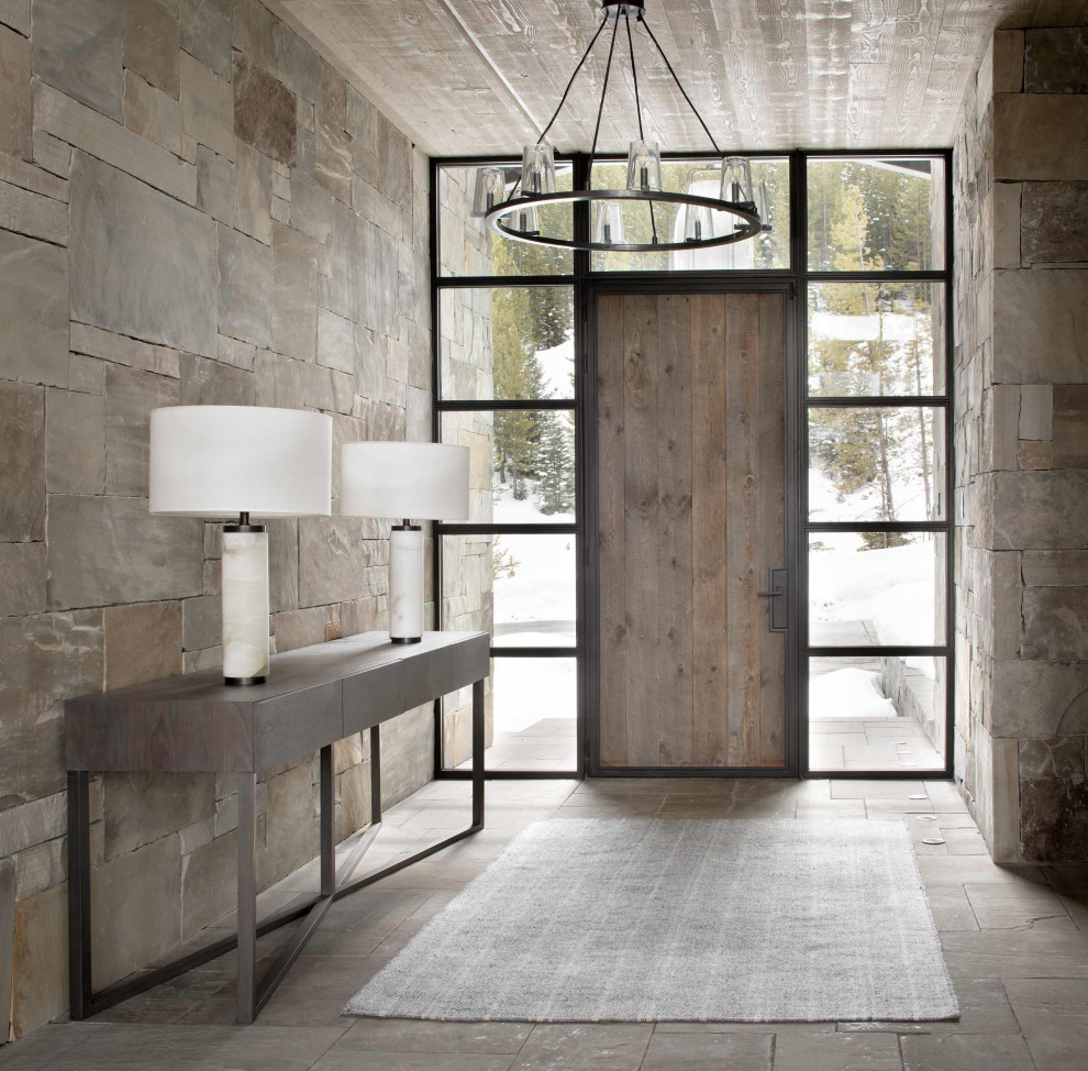 Mountain style wood ceiling front door photo with a medium wood front door