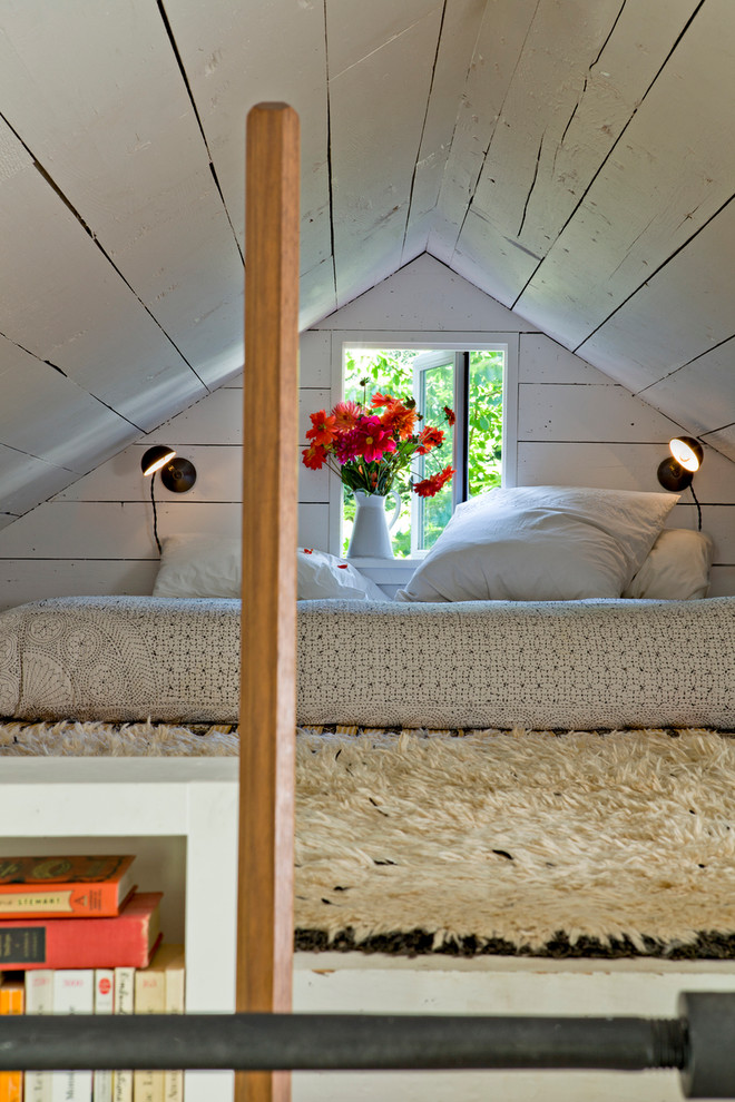This is an example of a traditional loft-style bedroom in Portland.