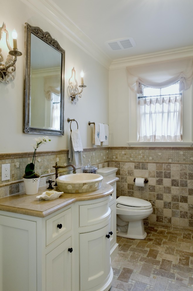 Contemporary bathroom in New York with mosaic tile and a vessel sink.