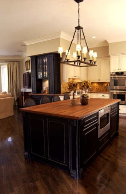 Open concept kitchen - large transitional l-shaped dark wood floor open concept kitchen idea with wood countertops and an island