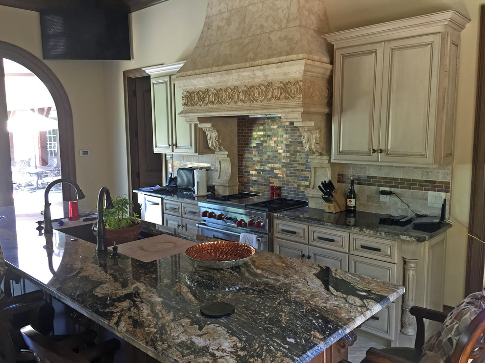 This is an example of a large mediterranean kitchen in Charlotte.