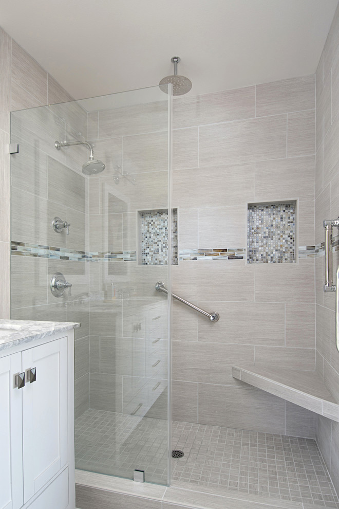 Photo of a small beach style 3/4 bathroom in San Diego with recessed-panel cabinets, white cabinets, an alcove tub, a double shower, a two-piece toilet, gray tile, porcelain tile, grey walls, porcelain floors, an undermount sink, quartzite benchtops, grey floor and a sliding shower screen.