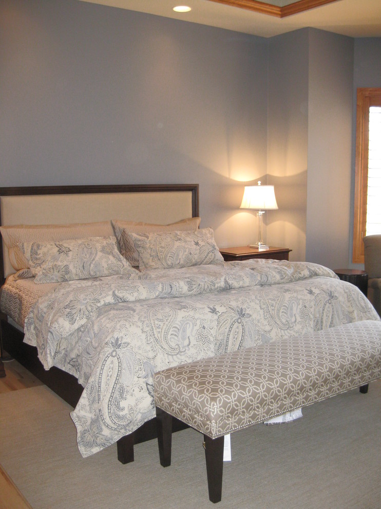 Large transitional master bedroom photo with brown walls