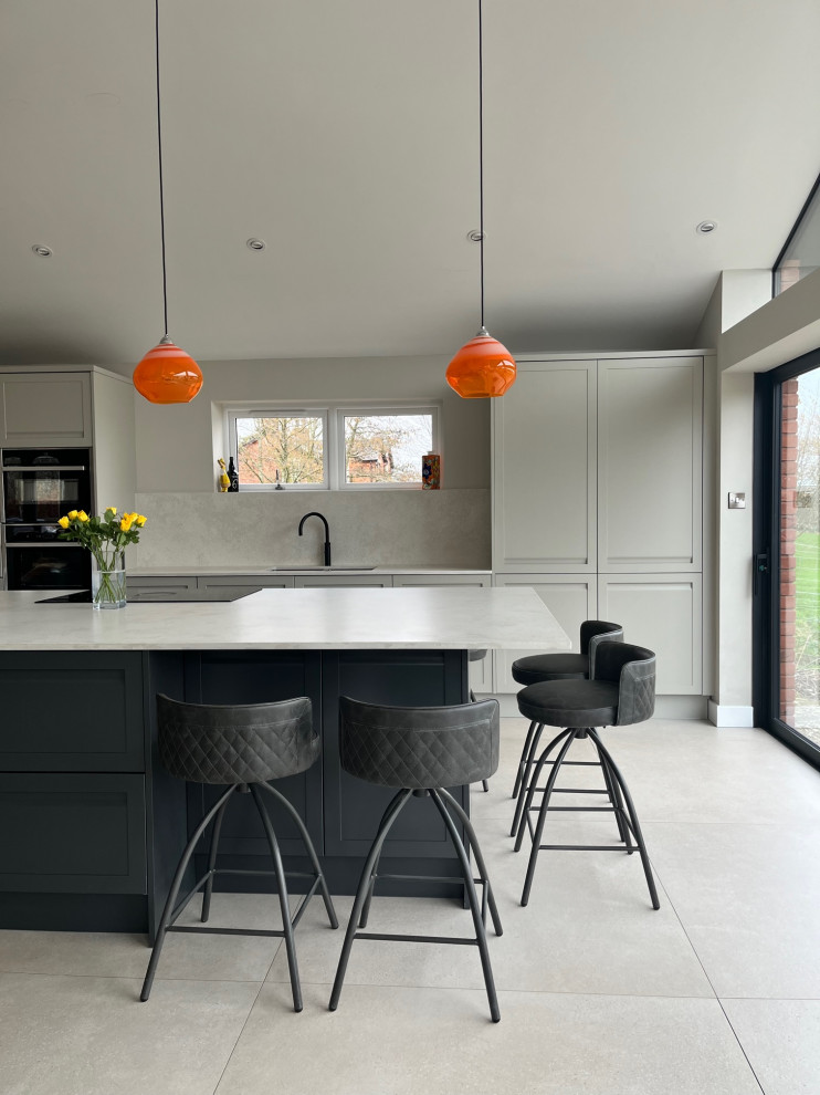 Large scandinavian open plan kitchen in Other with quartz worktops and an island.