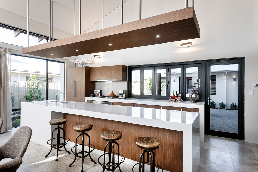 This is an example of a large contemporary galley kitchen in Perth with flat-panel cabinets, dark wood cabinets, panelled appliances, with island, a double-bowl sink, quartzite benchtops, grey splashback and glass sheet splashback.