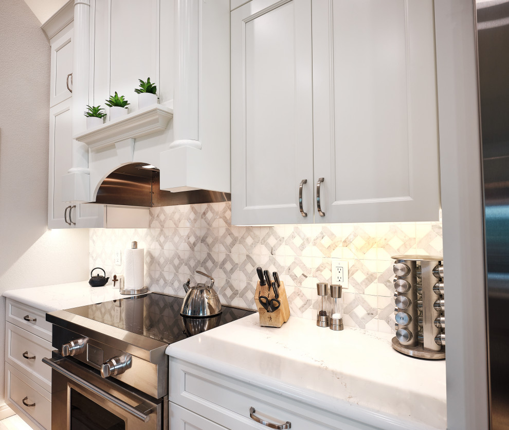 Example of a transitional kitchen design in Denver