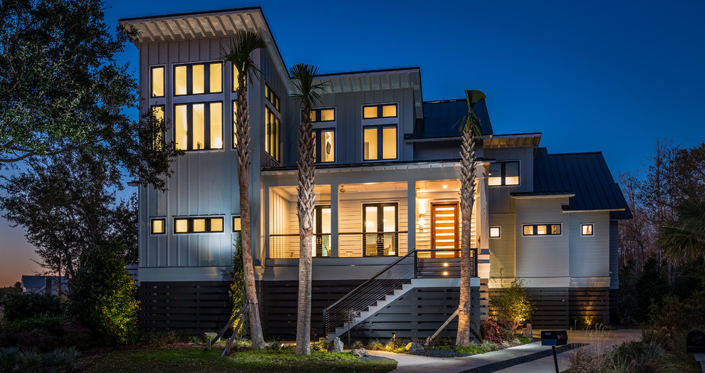 Large modern two-storey grey exterior in Charleston with concrete fiberboard siding and a gable roof.