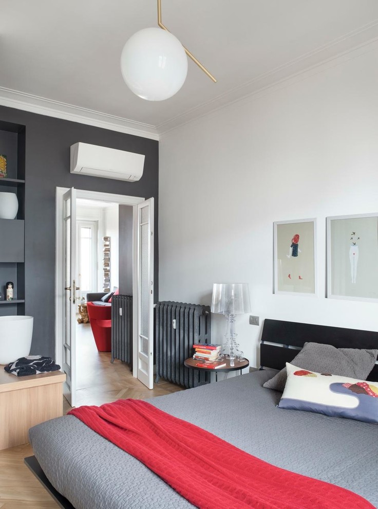 Contemporary bedroom in Milan with grey walls, light hardwood floors and beige floor.