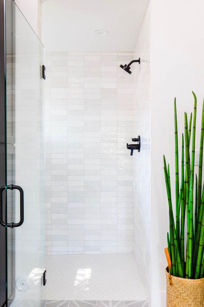 Large transitional master white tile and ceramic tile ceramic tile, gray floor and double-sink freestanding bathtub photo in Phoenix with shaker cabinets, black cabinets, quartz countertops, white countertops and a built-in vanity
