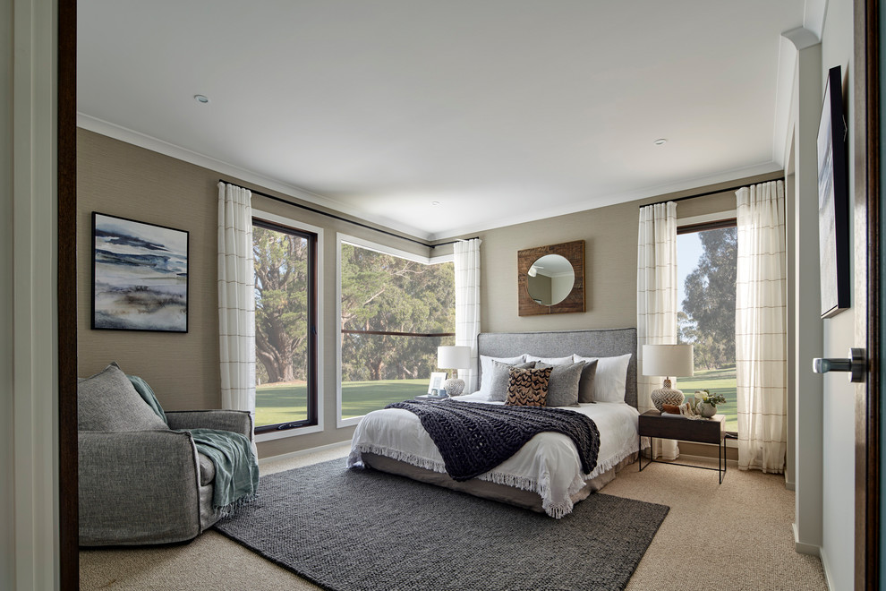 This is an example of a large beach style master bedroom in Other with beige walls, carpet and beige floor.