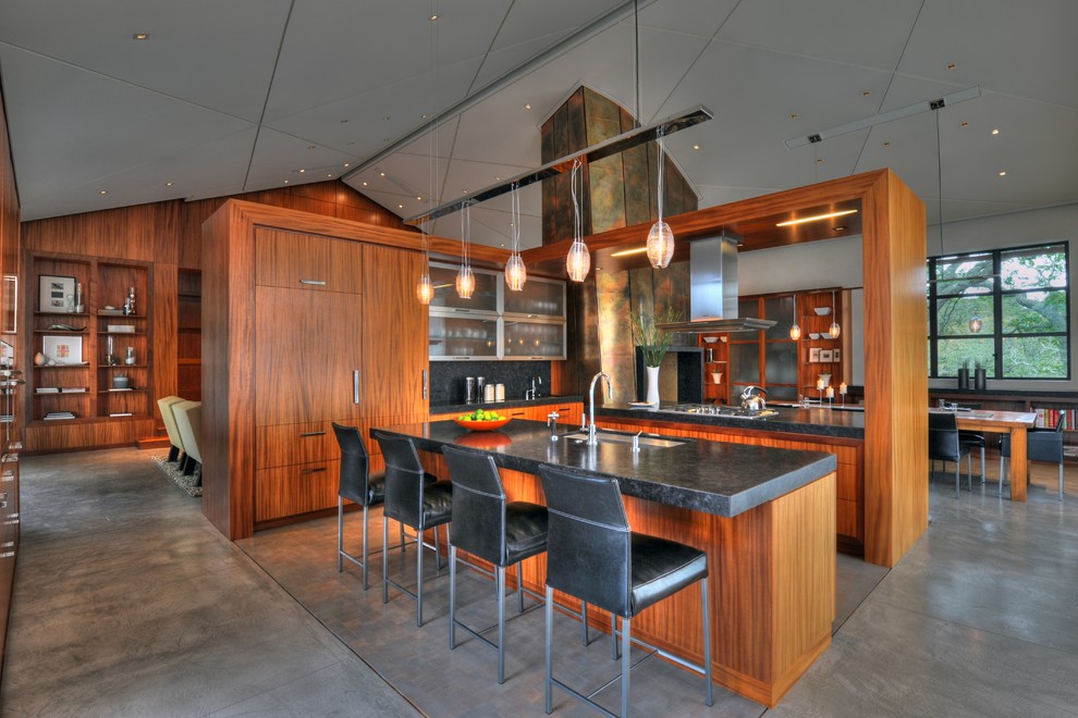 Photo of a mid-sized asian l-shaped open plan kitchen in San Francisco with an undermount sink, flat-panel cabinets, medium wood cabinets, marble benchtops, stainless steel appliances and with island.