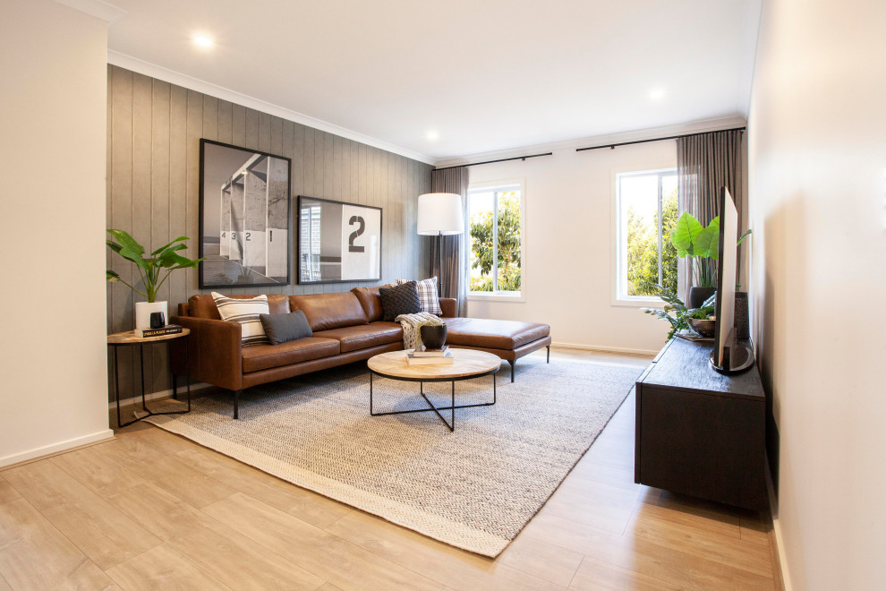 Photo of an industrial formal living room in Melbourne with grey walls, laminate floors, no tv and beige floor.