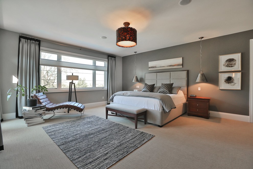 Inspiration for a mid-sized transitional master bedroom in Toronto with grey walls and carpet.