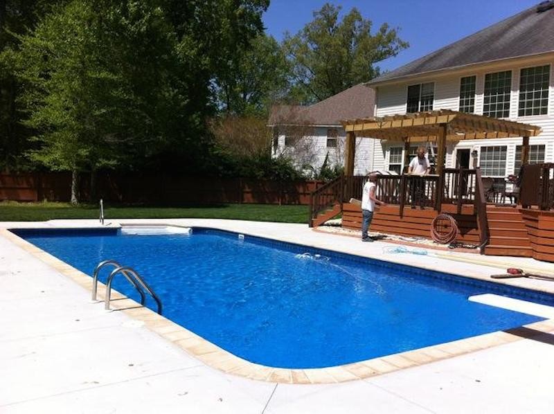 Inspiration for a backyard custom-shaped pool remodel