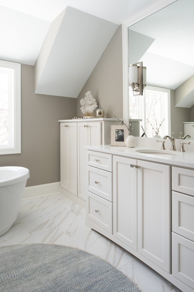 Photo of a small transitional master bathroom in Minneapolis with white cabinets, a freestanding tub, an open shower, a one-piece toilet, grey walls, porcelain floors, an undermount sink, engineered quartz benchtops, recessed-panel cabinets, multi-coloured tile, ceramic tile and multi-coloured floor.