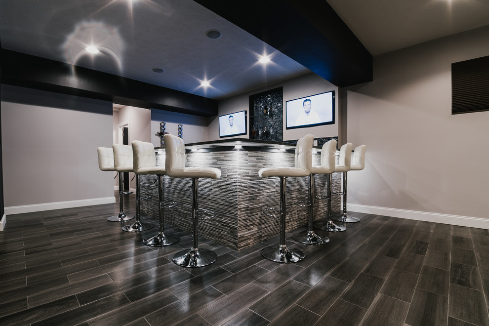Large contemporary u-shaped seated home bar in Other with black splashback, mosaic tile splashback and porcelain floors.