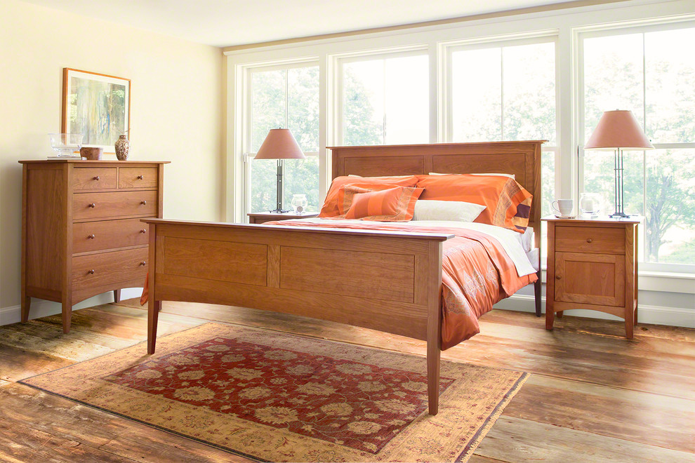 Example of a mid-sized classic bedroom design in Burlington