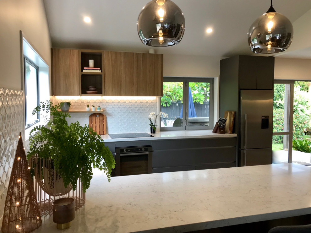 Inspiration for a modern kitchen in Auckland with white benchtop.