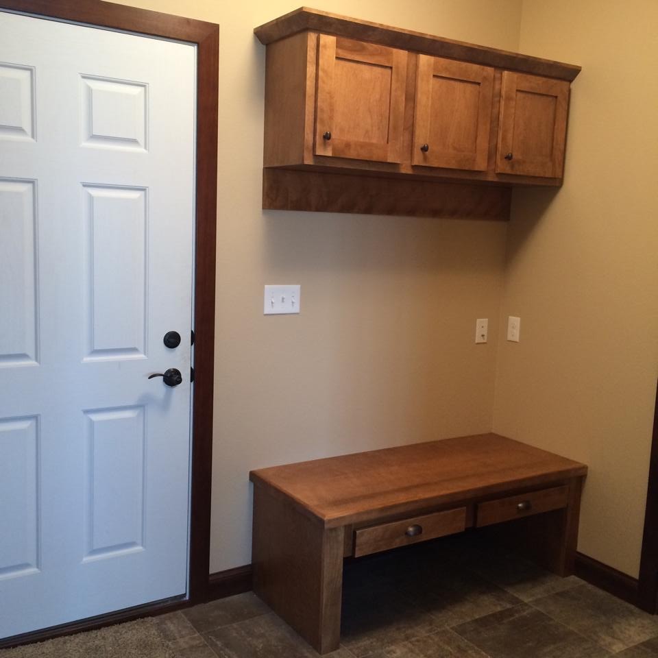 Mid-sized mountain style ceramic tile mudroom photo with beige walls and a white front door