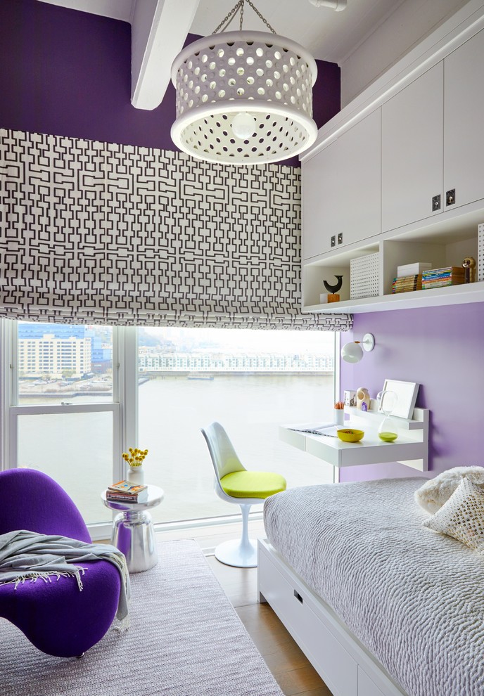 Contemporary kids' bedroom in New York with purple walls.