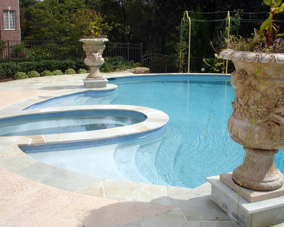 Design ideas for a large mediterranean backyard custom-shaped aboveground pool in New York with a hot tub and concrete slab.