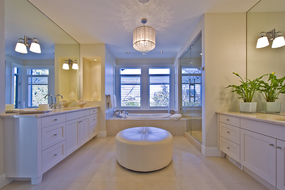 Contemporary bathroom in Vancouver with marble benchtops.