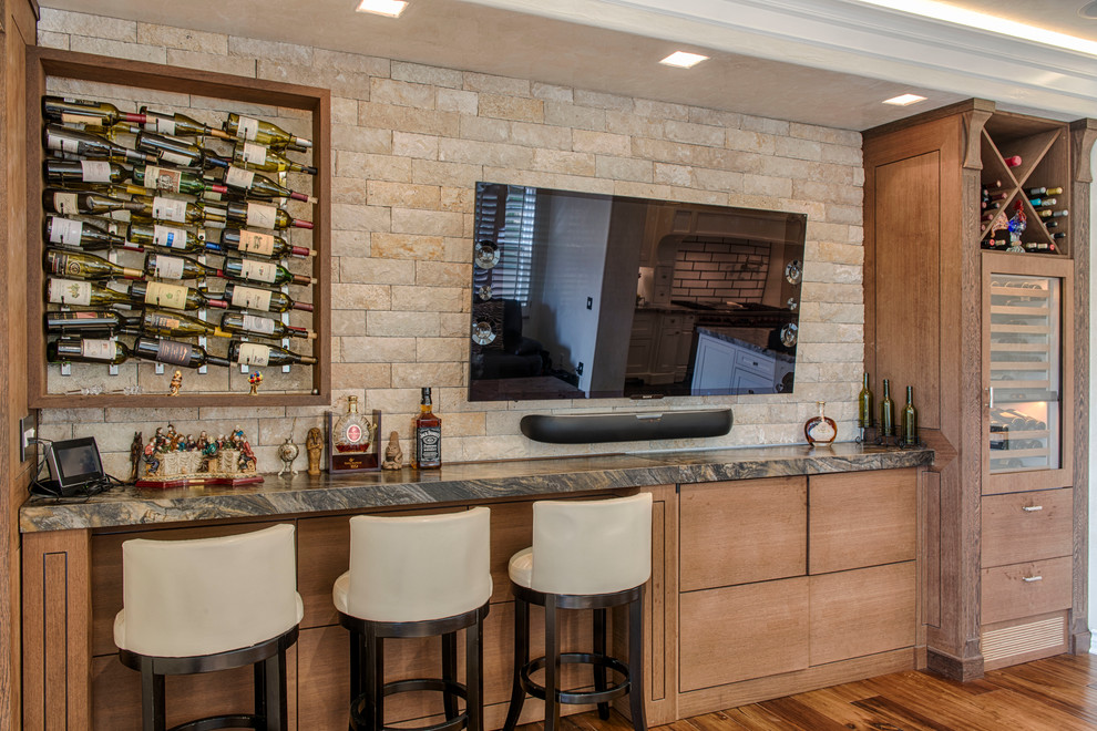 Inspiration for a traditional home bar in Los Angeles with medium hardwood floors.