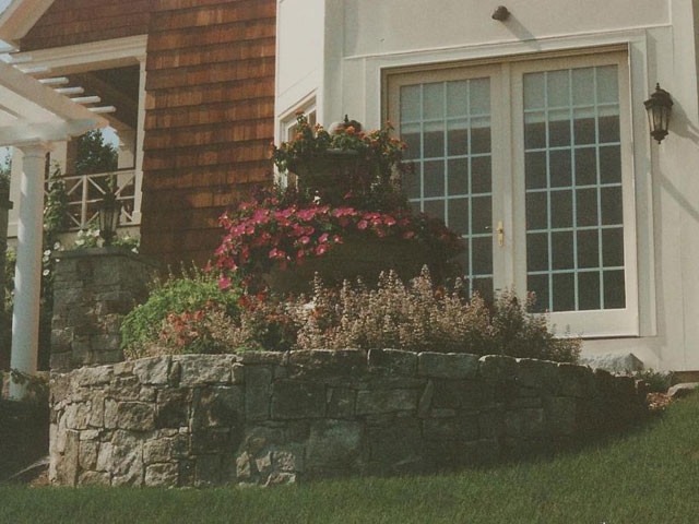 Inspiration for a mid-sized partial sun side yard stone landscaping.