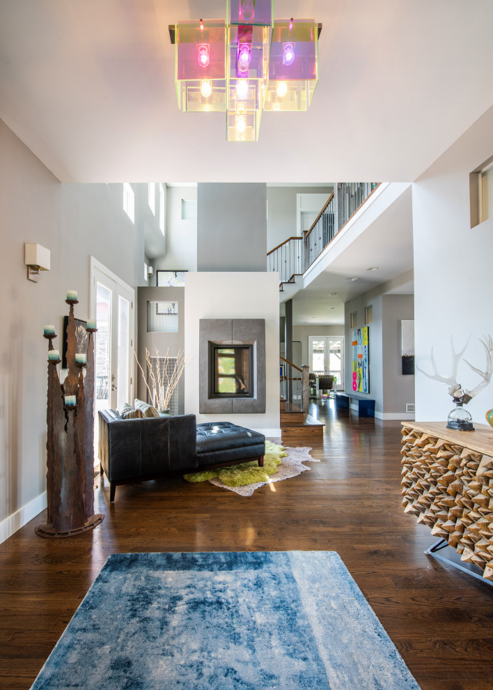 Inspiration for a large eclectic foyer in Denver with grey walls and medium hardwood floors.