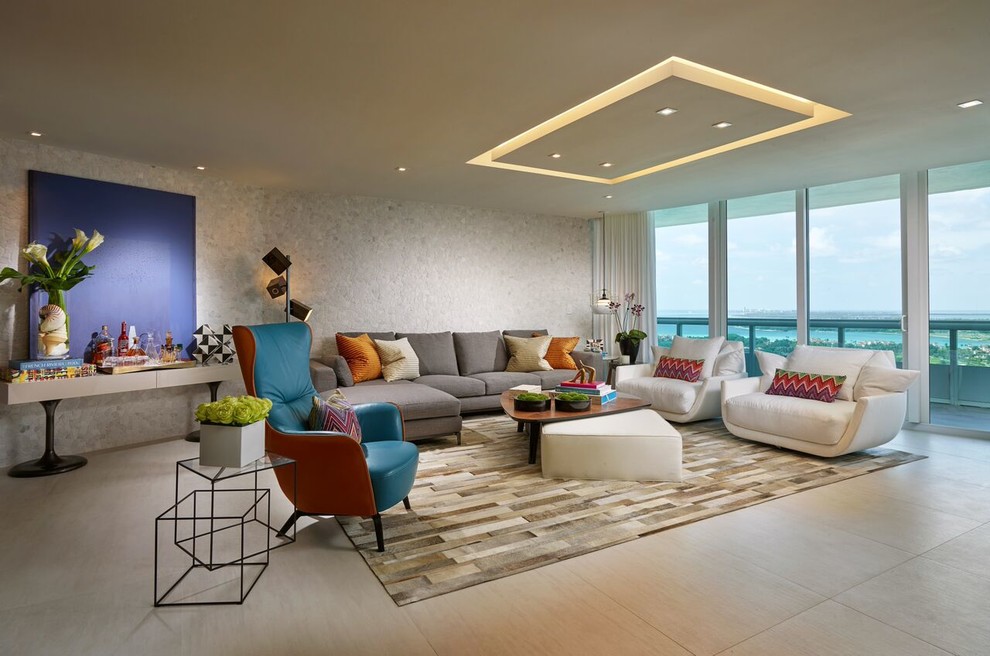 This is an example of a mid-sized contemporary open concept living room in Miami with a home bar, grey walls, porcelain floors, no fireplace and a built-in media wall.