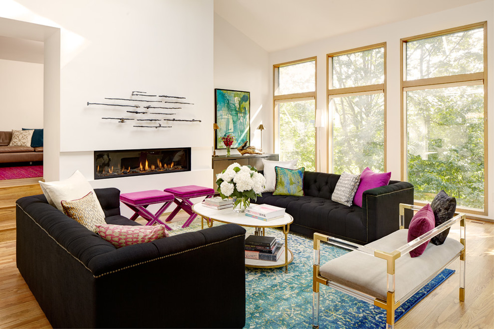 Inspiration for a transitional living room in Seattle with white walls, medium hardwood floors and a ribbon fireplace.
