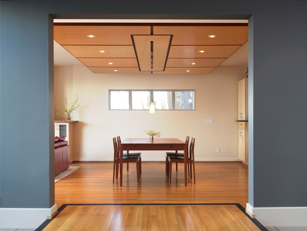 This is an example of a contemporary dining room in Seattle with grey walls.
