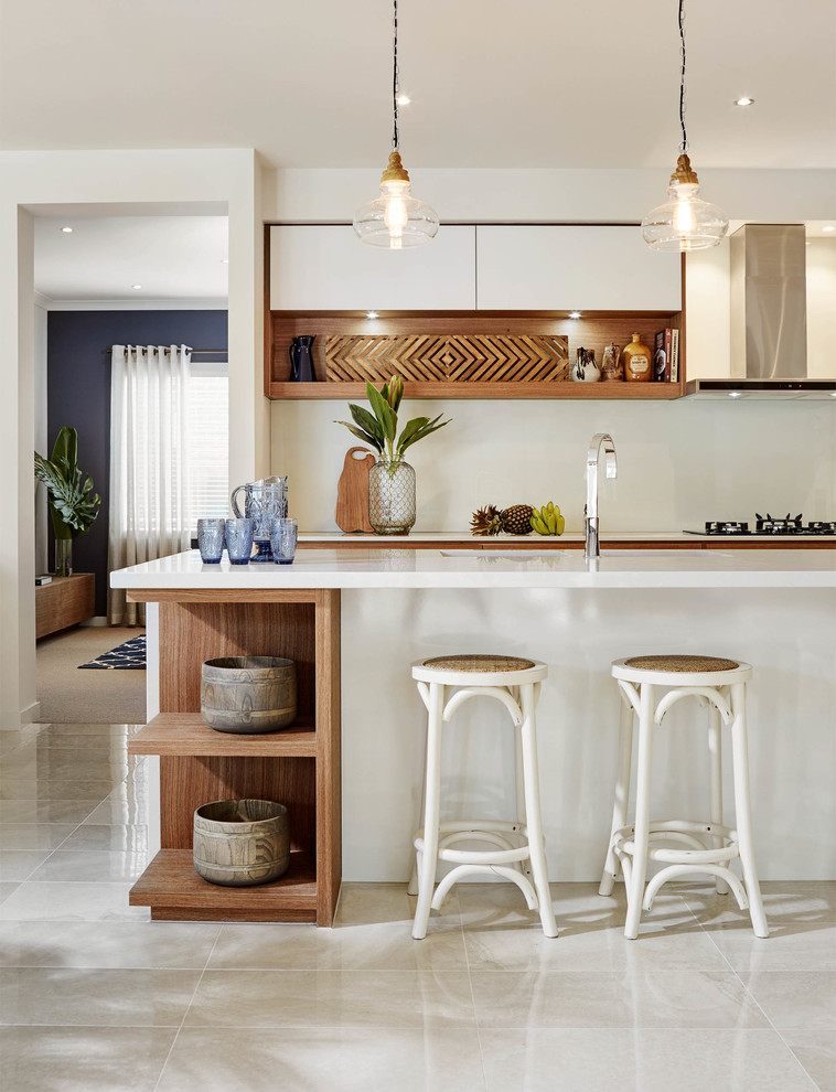 Photo of a beach style kitchen in Melbourne with open cabinets and with island.