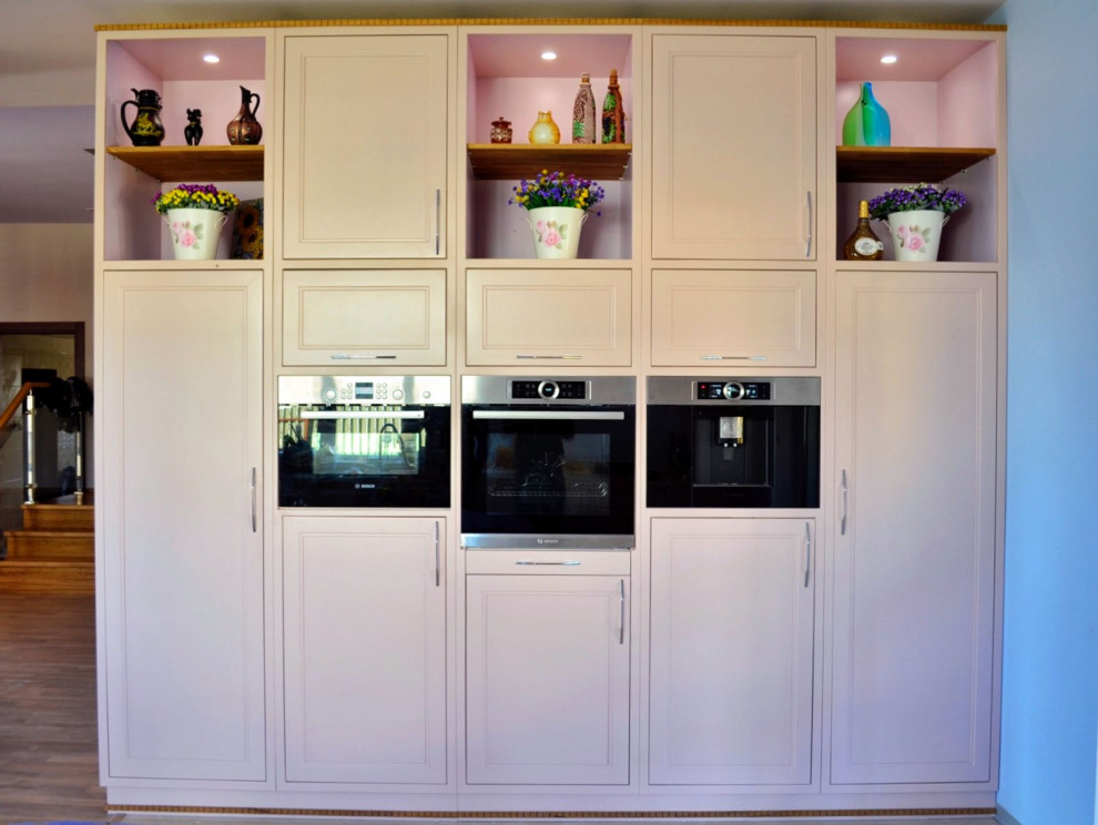 Large farmhouse l-shaped kitchen/diner in Moscow with a submerged sink, raised-panel cabinets, white cabinets, engineered stone countertops, blue splashback, engineered quartz splashback, black appliances, porcelain flooring, a breakfast bar, multi-coloured floors, multicoloured worktops and a drop ceiling.